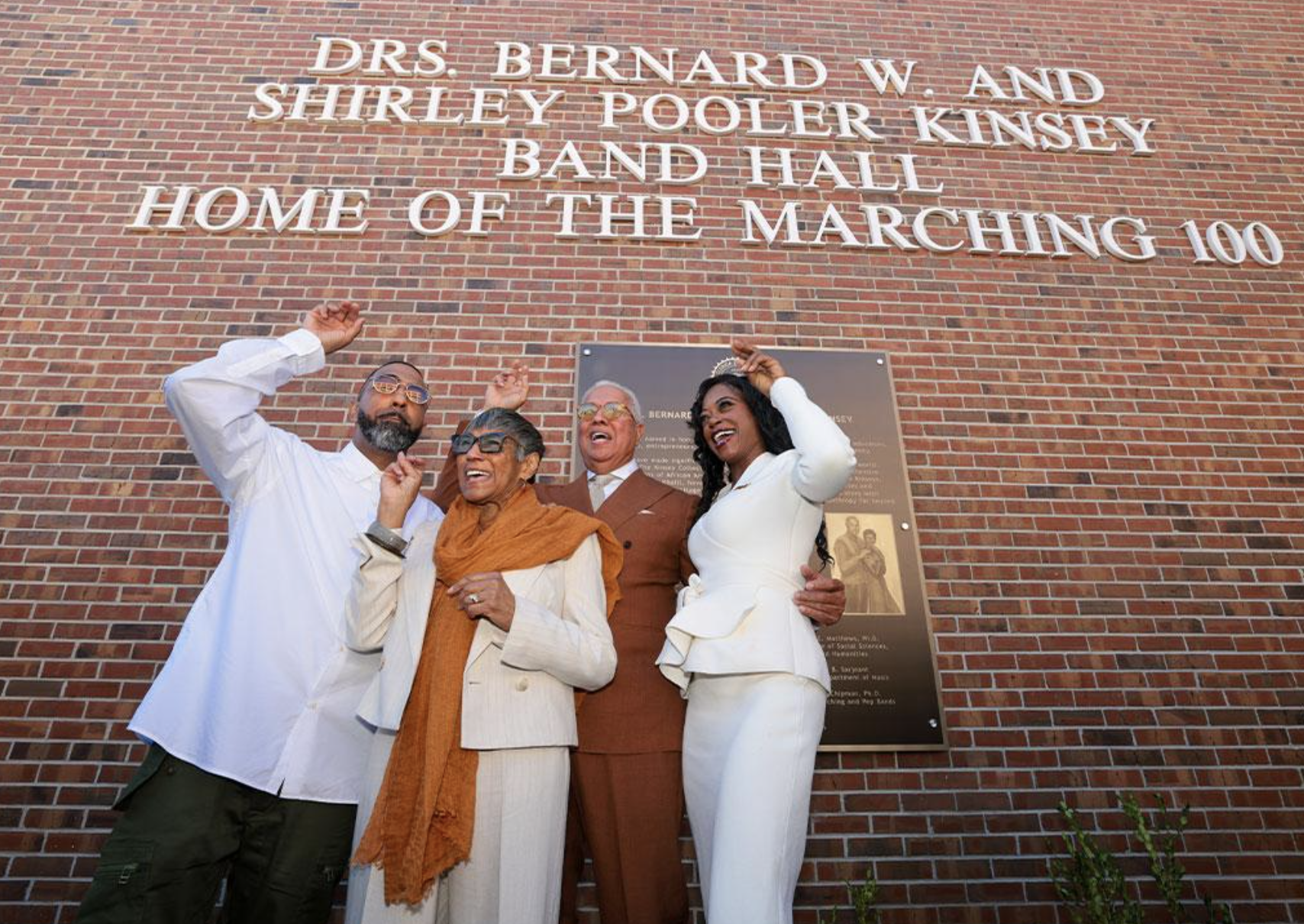 For the featured photograph, describe the actual subjects shown. For example, if you're using FAMU's official photograph of the Kinseys, use: Bernard and Shirley Kinsey at FAMU's 2026 Homecoming Convocation following their $2 million Marching 100 commitment.